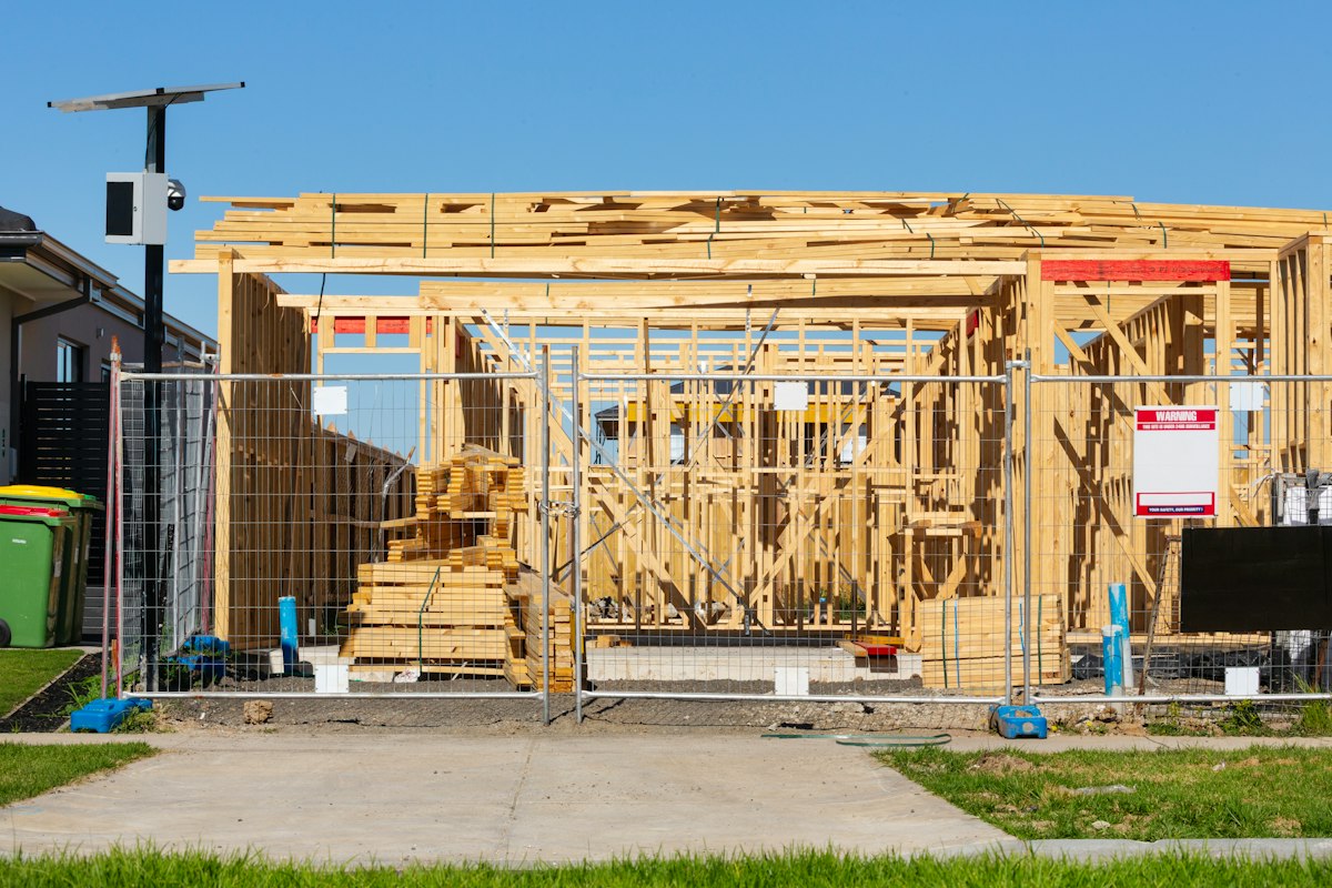 Professional architect reviewing house construction blueprints and plans